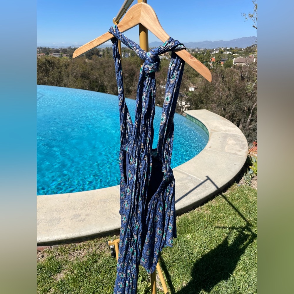 One Way blue romper size 8. V-neck & open-back. Can wrap and wear several ways.